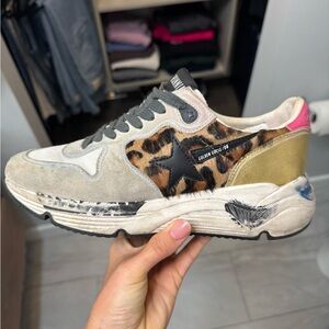 Golden Goose Black and Gold Sneakers with Fashion-Forward Design